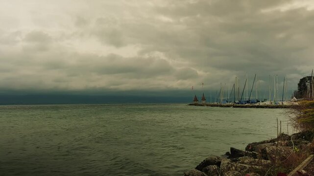 Establishing shot of Morges port, lake Geneva and moody weather in Canton of Vaud Switzerland