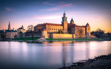 Fototapeta premium Krakow's Wawel Castle, Poland Majestic castle at sunset reflected in calm river.