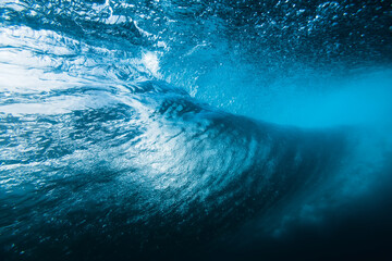 Barrel wave underwater in clear ocean. Perfect sea wave breaking in ocean