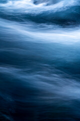 Fototapeta premium View of flowing rushing water on the river in Iceland. Nature, travel, winter background, or wallpaper