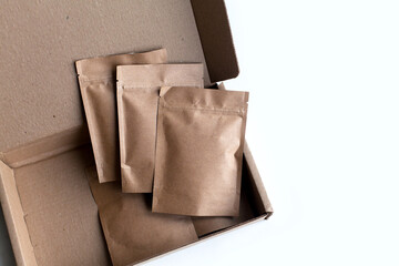 Kraft brown paper empty bags isolated mock up on white background. Eco friendly pack with zipper,...