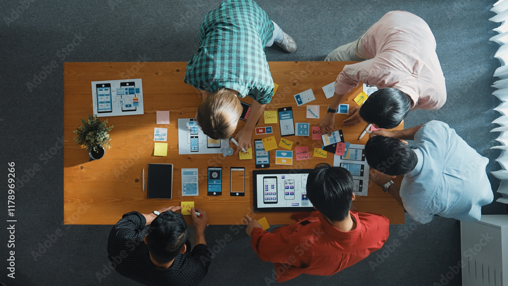 Fototapete top down view of business team writing idea on sticky note while planing for ux ui design for mobile