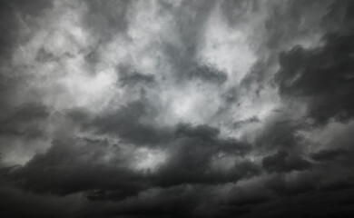 dark dramatic sky with black stormy clouds before rain as abstract background, extreme weather