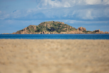 sand dune and Ogliastra islet in the background, Sardinia, Italy