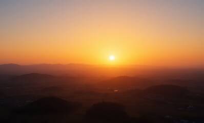 Serene sunset over rolling hills