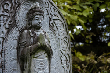A religious stone statue of Bodhisattva Samantabhadra at Japanese buddhism temple
