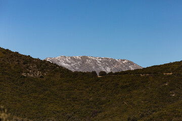 Gennargentu seen from Perda Liana a beautiful and imposing rock monolith on Supramonte in National Park of the Gulf of Orosei and Gennargentu. Ogliastra, Sardinia, Italy