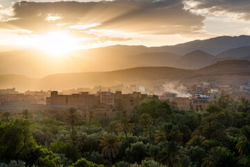 Old town and palm tree oasis in the desert at sunset, Tinghir, Morocco