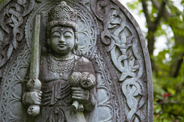 A religious stone statue of Akasagarbha at Japanese buddhism temple