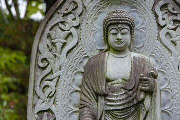A religious stone statue of Akshobhya at Japanese buddhism temple