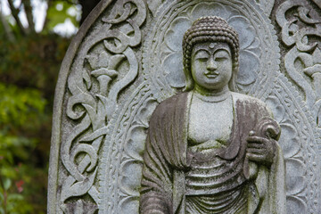 A religious stone statue of Akshobhya at Japanese buddhism temple