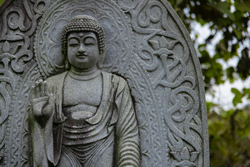 A religious stone statue of Shaka Nyorai at Japanese buddhism temple