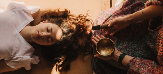 Close up of female mentor and student before Mindful meditation and yoga in the gazebo....