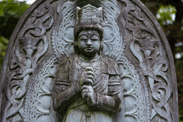 A religious stone statue of Dainichi Nyorai at Japanese buddhism temple