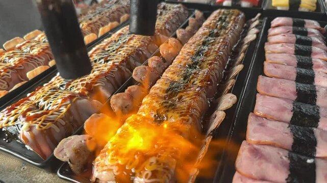 slow shot Flaming sushi and meat street food! Watch as we torch fresh sushi and meat over an open flame for an unforgettable culinary experience