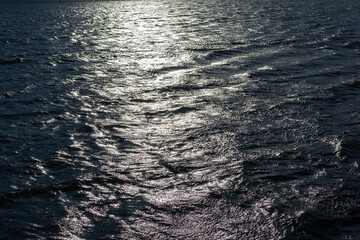 Sunlight reflected off water surface in high contrast