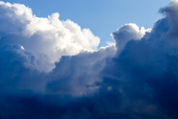 Dramatic storm clouds in sunlight