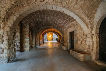 Medieval Stone Corridor with Stunning Vaulted Arches and Warm Light. Historic Underground Passage in Peratallada, Catalonia (Historic Underground Passage in Peratallada)