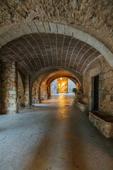 Medieval Stone Corridor with Stunning Vaulted Arches and Warm Light. Historic Underground Passage in Peratallada, Catalonia (Historic Underground Passage in Peratallada)