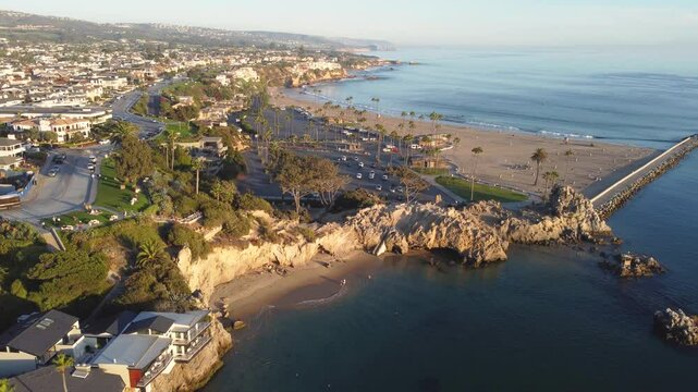 Newport Beach, Orange County, Southern California Coast, USA. Corona Del Mar, Pirates Cove Cliffs. Newport Bay Harbour Jetty. Fly over Cliffs and Parking Lot. Coast Line Looking Toward Laguna