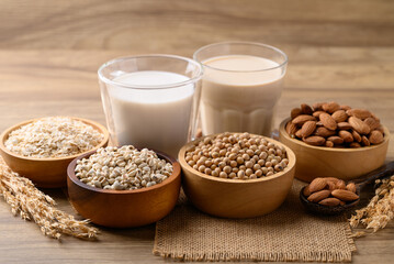 Alternative milk made from plant on wooden background, non dairy, Vegan food