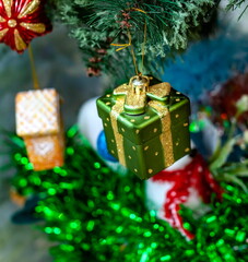 Christmas toys on an artificial Christmas tree close-up