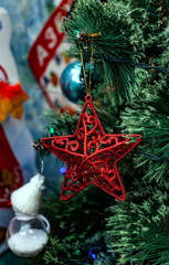 Christmas toys on an artificial Christmas tree close-up