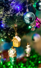 Christmas toys on an artificial Christmas tree close-up