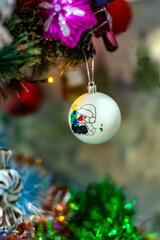 Christmas toys on an artificial Christmas tree close-up