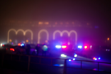 Foggy city, cold winter air in the city, lights of police cars: traffic regulation © Daniel