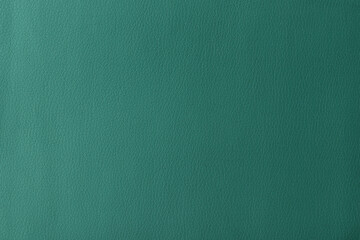 Texture of genuine leather, artificial leatherette green background