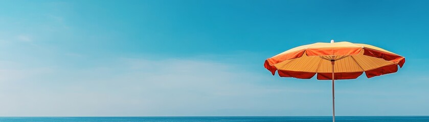 Striped beach umbrella providing shade on a sunny relaxing