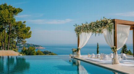 A stunning poolside wedding ceremony decor with white drapes, floral arrangements 