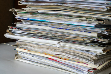 A stack of old papers and price lists like waste paper.