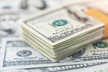 Fototapeta premium Stacks of cash with focus on banknotes, symbolizing financial control and loans