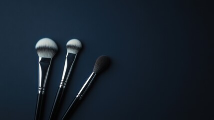 Professional-grade makeup tools on a matte navy background