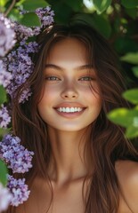 Beautiful young woman with natural makeup and a smile, surrounded by lilac flowers