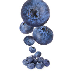 Fresh ripe blueberries falling on white background