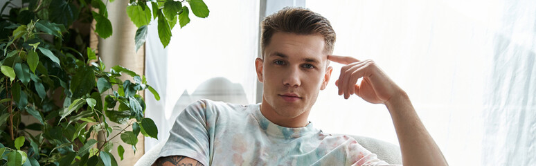 Handsome young man with a prosthetic leg striking a confident pose in a bright indoor setting