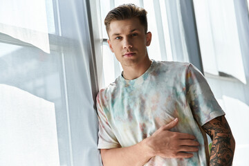 Handsome young man posing in a modern space with a prosthetic leg and artistic style