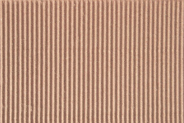 A sheet of brown recycled corrugated cardboard texture as background