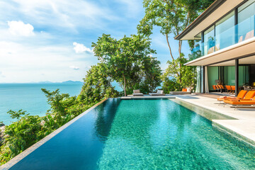 Fototapeta premium Luxury beach resort, villa bungalow with infinity pool over the sea. Paradise and tropical island, vacation and travel concept