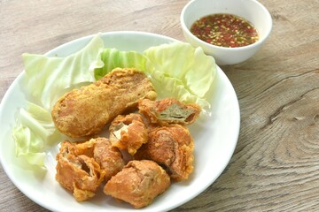 fried slice Vietnamese chicken sausage recipe with cabbage on plate dipping spicy sauce