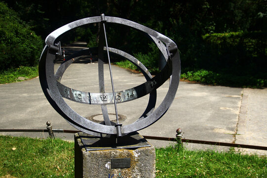 Berlin, Germany - July 9, 2024: Old sundial clock in English Garden in Tiergarten park, Berlin