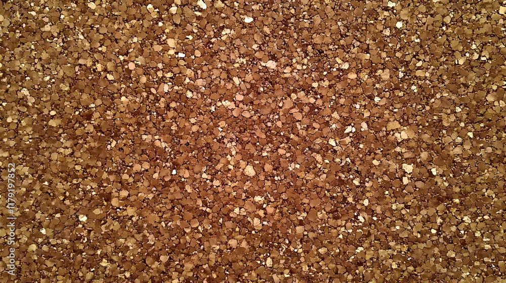 Poster close-up of brown glitter creates a sparkling textured background ideal for design projects.