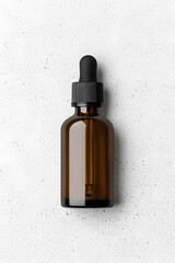 Fototapeta premium Amber glass dropper bottle with black cap mock up isolated on white background