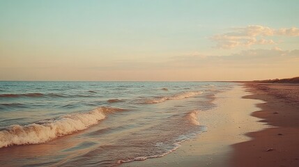 A serene ocean view with small waves and golden sand under a pastel-colored sky, creating a tranquil mood