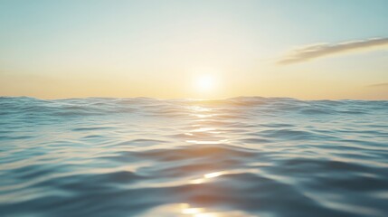 Obraz premium A peaceful ocean view with soft ripples meeting a sandy beach, framed by faintly glowing golden hour light