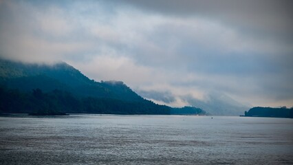 Mekong River and mountain with fog in the morning at  Luang Prabang, Laos.