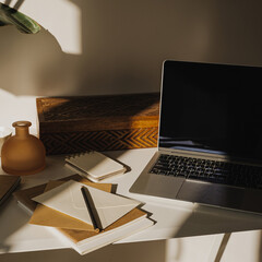 Minimalist Workspace with Laptop and Stationery